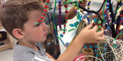 a child playing with beads