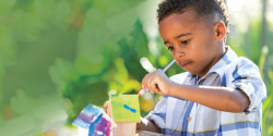 a child painting a craft project