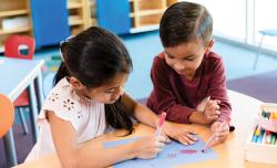 children doing art on a table