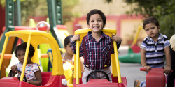 some kids playing with outdoor toys