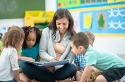 Teacher with students in a classroom