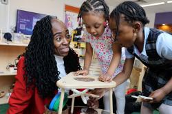 Carlyn Rahynes working with children in a classroom
