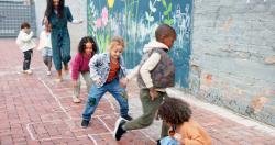 A group of kids playing hopscotch outside
