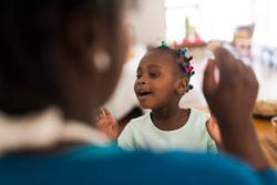 A young child singing