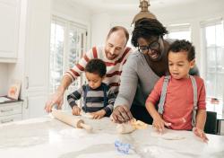 Parents helping children in the kitchen