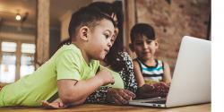 2 children with parent doing a zoom course