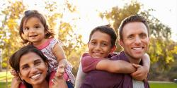 family of four outside in nature