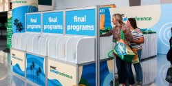 Annual Conference attendees picking up final programs