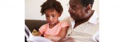 Child and parent reading a book