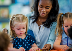 Teacher playing with her students