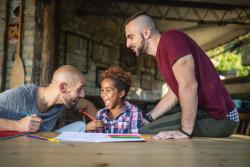 Parents working with their son.