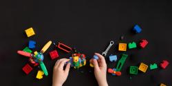 young child playing with legos