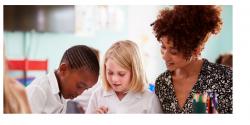 teacher reading with children