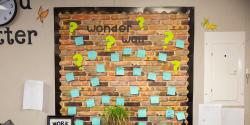 a wall with sticky notes on it