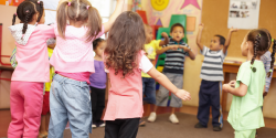 children dancing in a circle