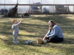 An educator and student playing outside