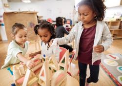 A group of children building with blocks