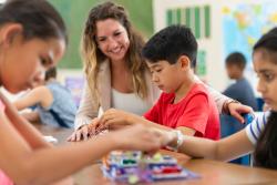A student and teacher working on a project together
