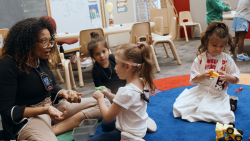 Lauren Fleming working with children in the classroom