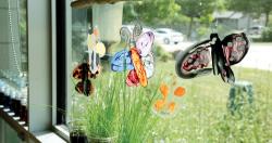 butterfly sculptures hanging in window