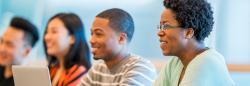 Early childhood professionals listen attentively to a lecture