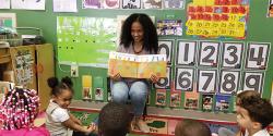 Jennifer Scott in her pre-K classroom, reading to hear students