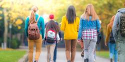 College students walking with backpacks