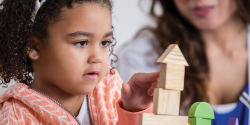 a child playing with blocks