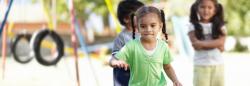 Little girl playing on a  playground