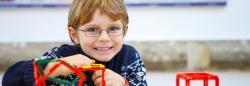 Young boy playing with plastic cubes