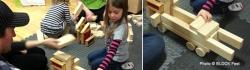 Young children playing with blocks in the classroom.