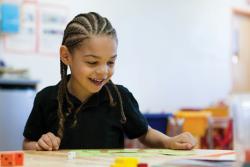 Child enjoying math activities.