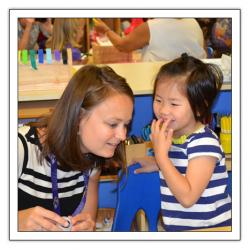 Teacher listening to a child's story