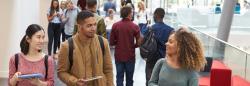 Adult students walking down a hallway