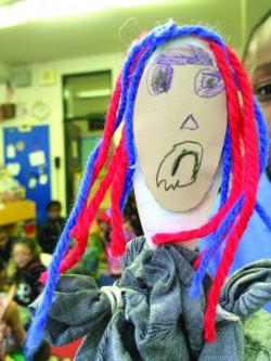 Children create peace puppets to support their developing social and emotional skills