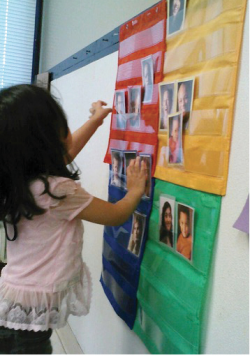 A child uses the mood meter to share her current feelings.