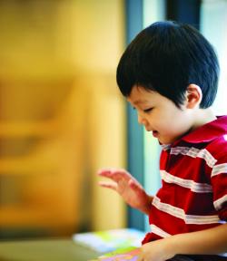 Child reading out loud.