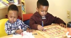 Two boys working at a table