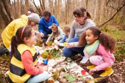 Children and adults working together to learn about the environment