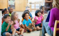 Children smiling and learning during circle time