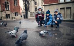 Teacher and two students observing pigeons