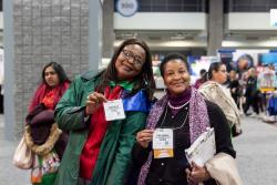 Two women pose for a picture at NAEYC's Annual Conference