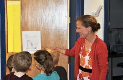 Teacher showing students an illustration