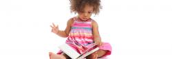 Toddler reading a book