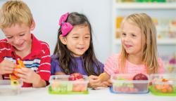 Three children eating lunch