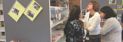 Three teachers looking at student artwork