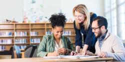 adults looking at a document together