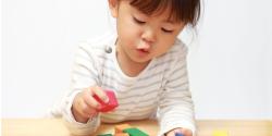 a child playing with blocks