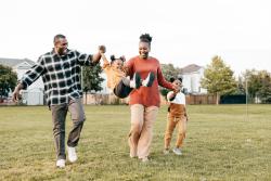 A happy family playing outside.