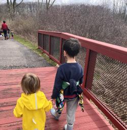 Two children holding hands walking